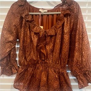 Beautiful brown and orange peplum blouse with subtle accents of gold